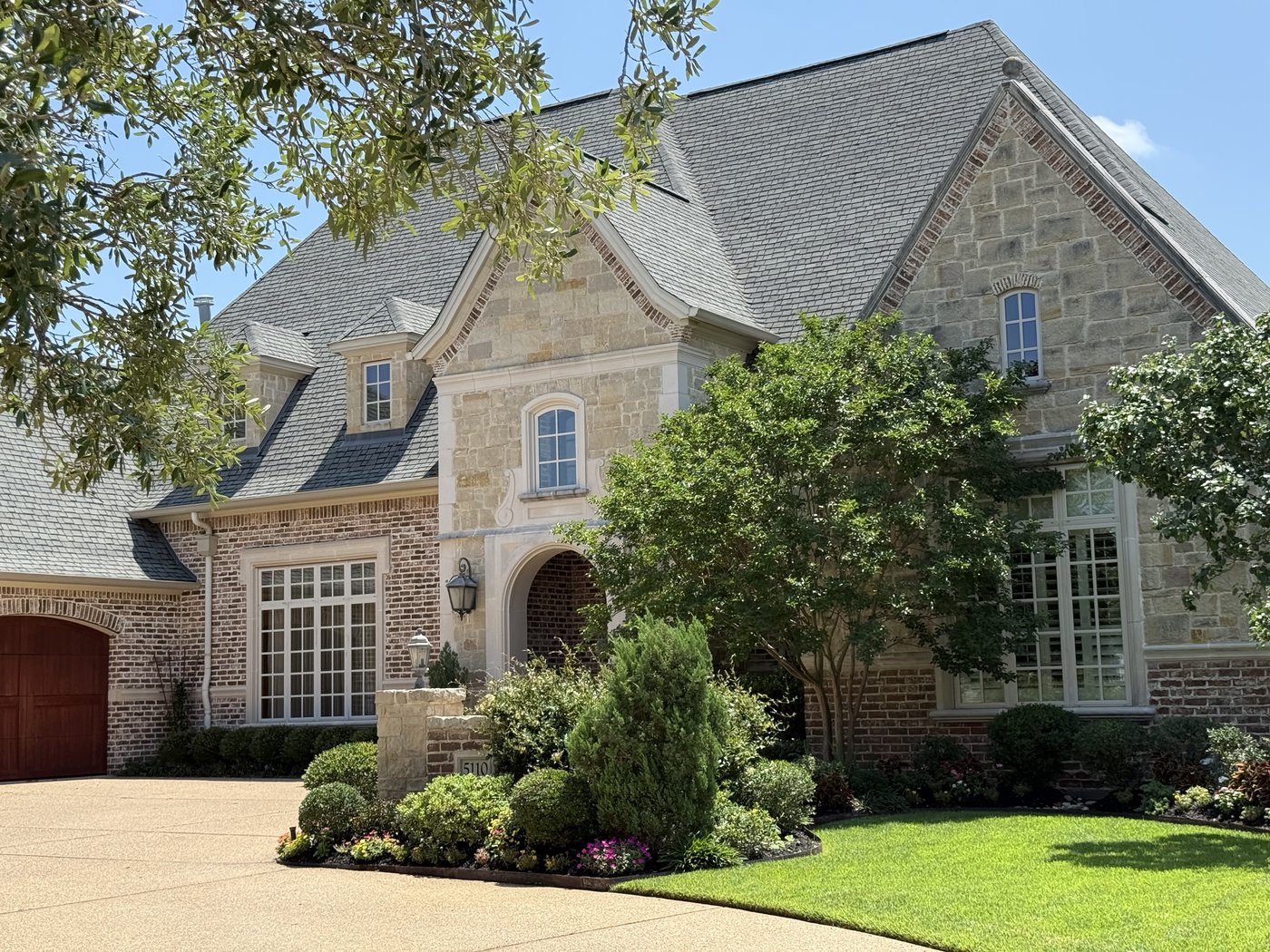 Antique 28 inch ledge cut to 4-6-8 inch heights paired with brick on a French country residence