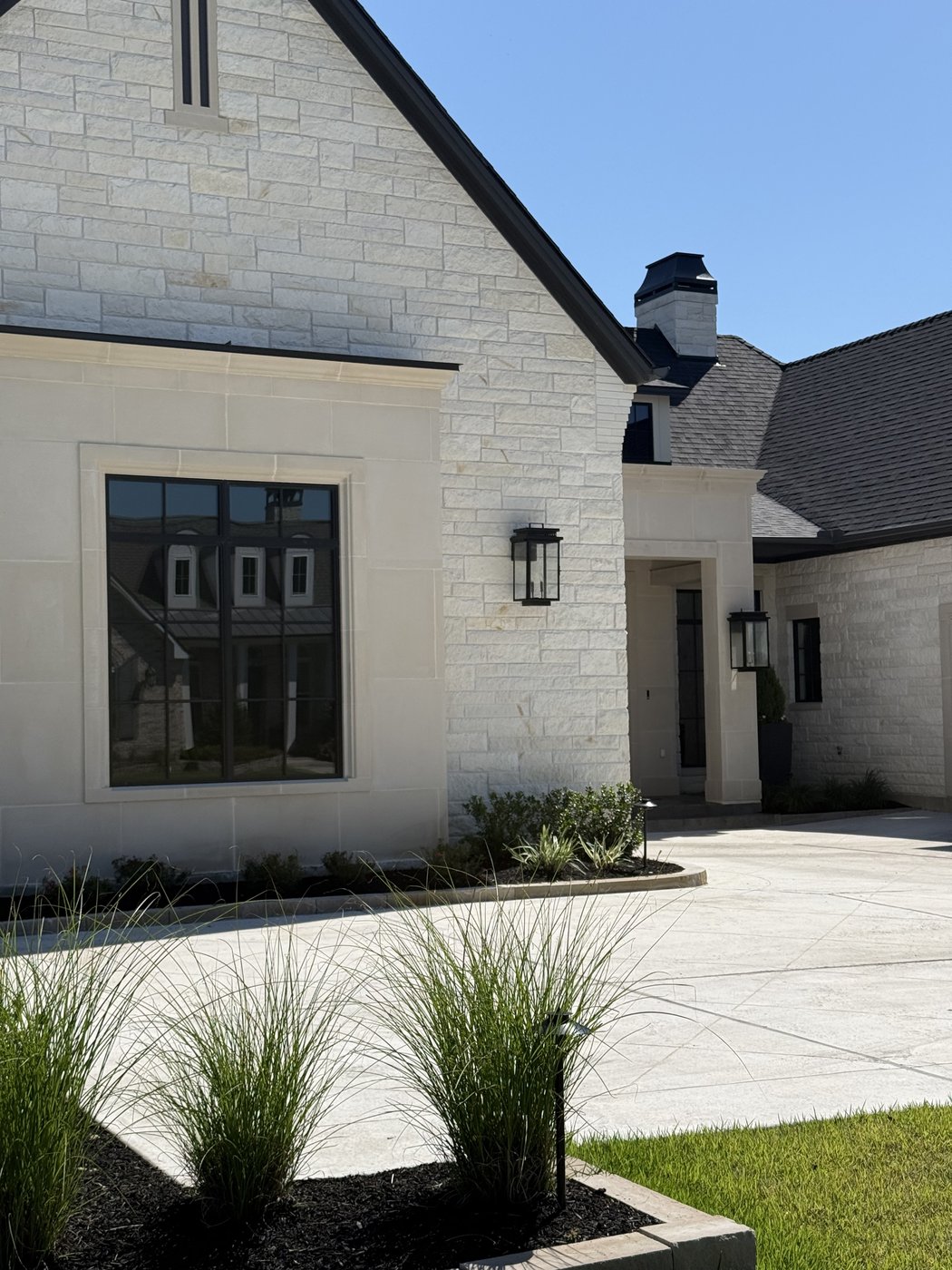 Twin-gable modern residence — Austin White 4-6-8 longer-length pieces, entry-side angle