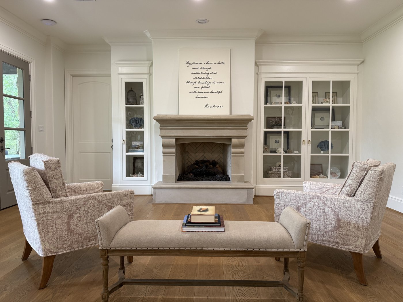 Custom-fabricated 20 inch ledge Castle Grey fireplace surround with corbeled mantel and stepped molding in a residential living room