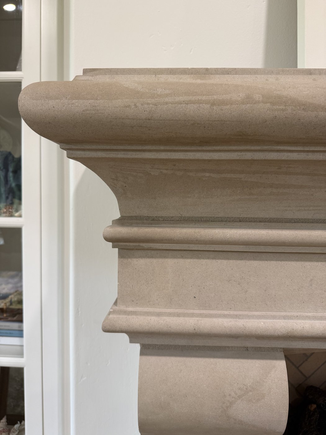 Mantel cap profile detail — Castle Grey 20 inch ledge custom fabrication showing the rolled top edge and dentil-style underside
