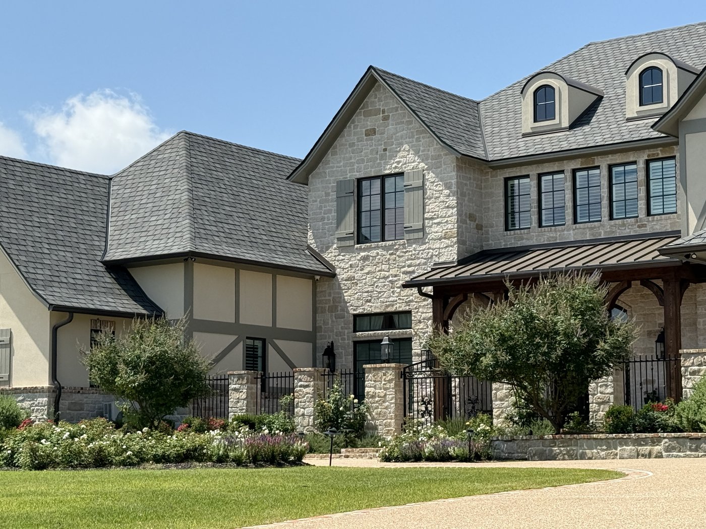 Castle Grey tumbled with caramel accent stones on a Tudor residence