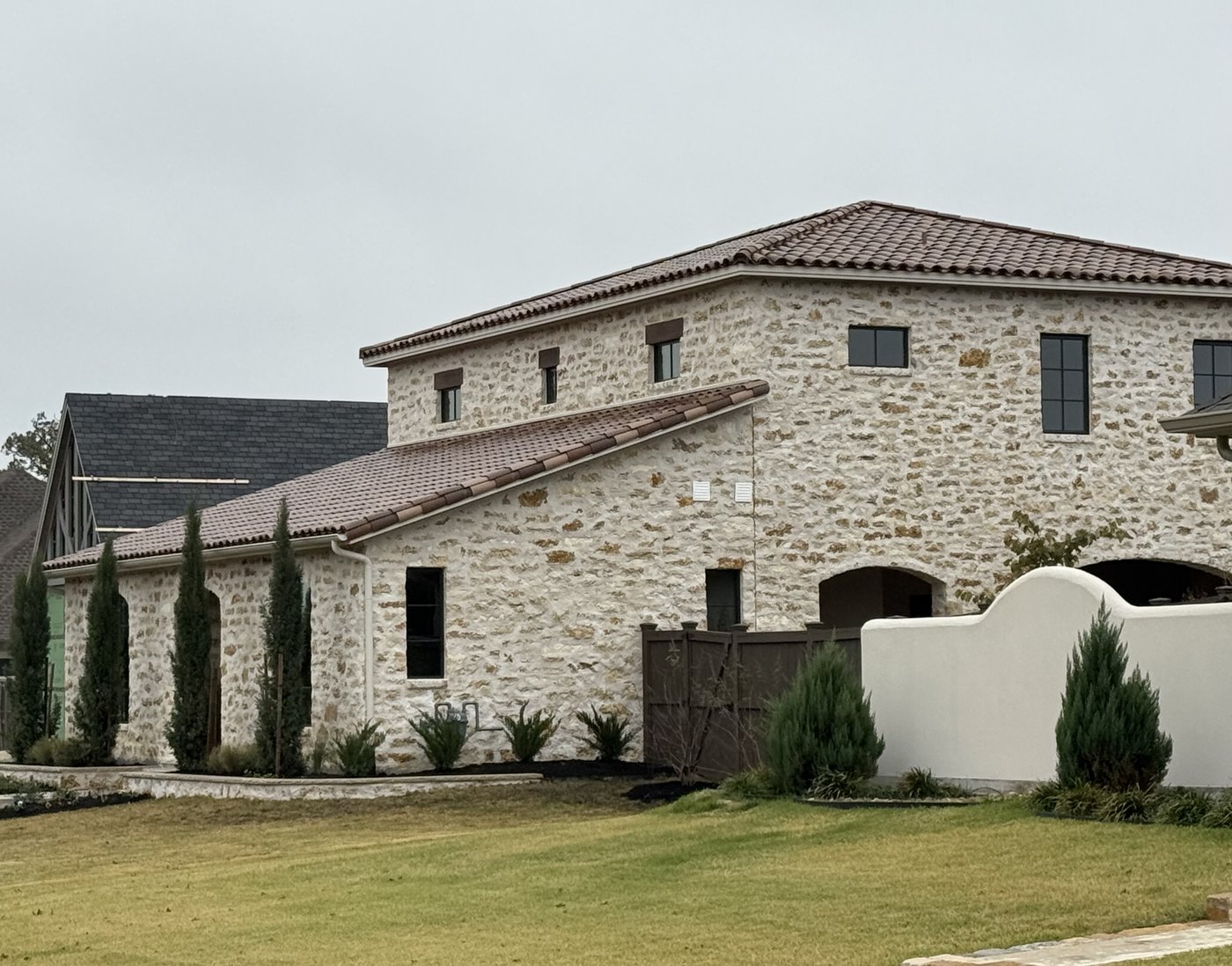 Italian villa residence — Cavestone random ashlar with heavy smear joint and terracotta tile roof