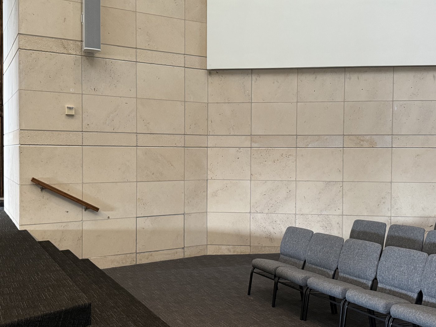 Auditorium interior — Crescent Cream honed wall panels