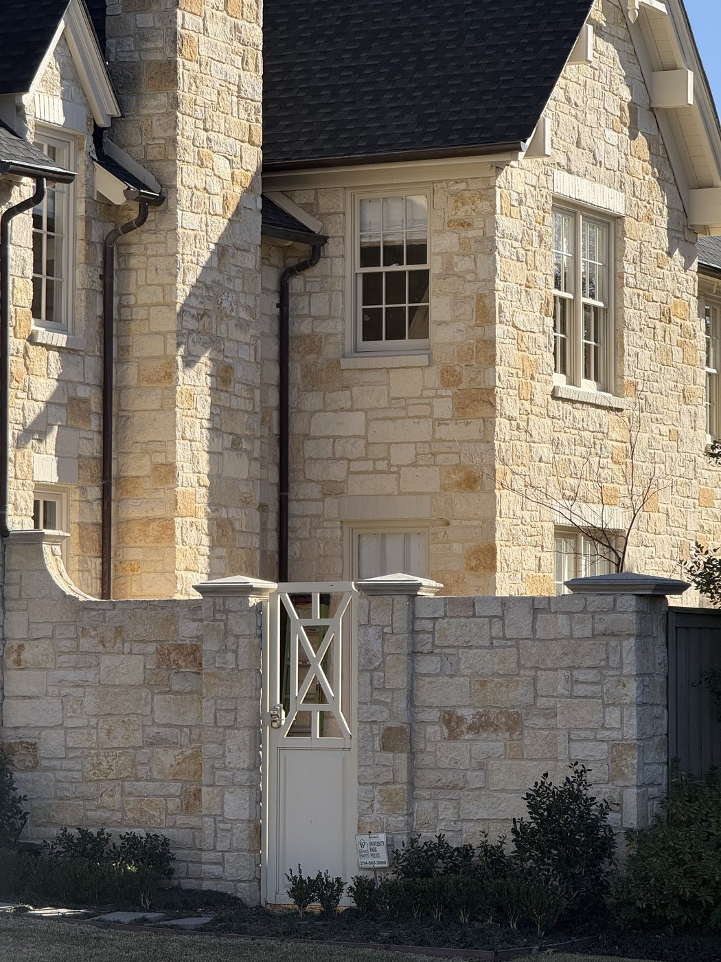 Goldstone chopped random ashlar — dormer and balcony detail on the same residence