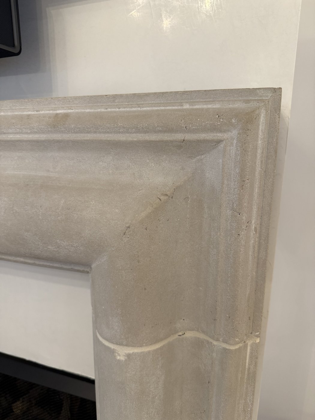 Honed grey ledge fireplace surround — corner molding profile detail