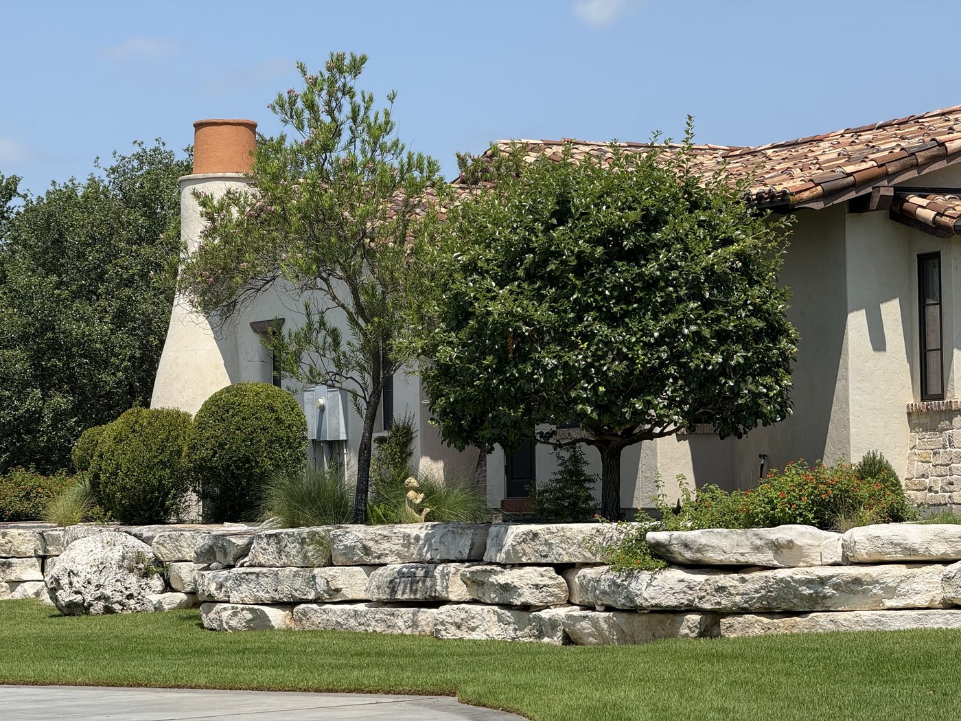 Landscape — natural limestone boulder retaining wall