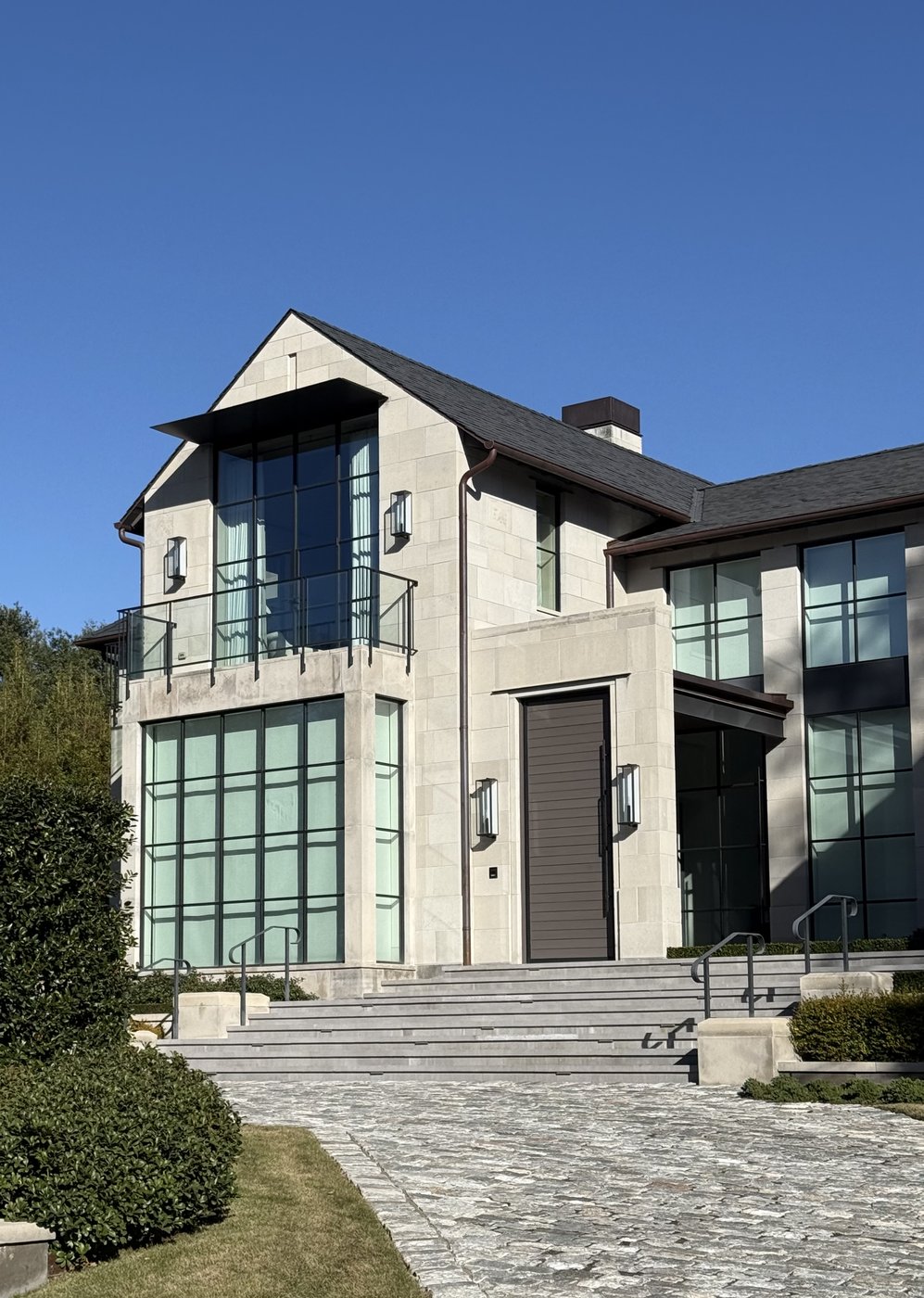 Modern contemporary residence — Whitewing entry tower with double-height steel doors and balcony