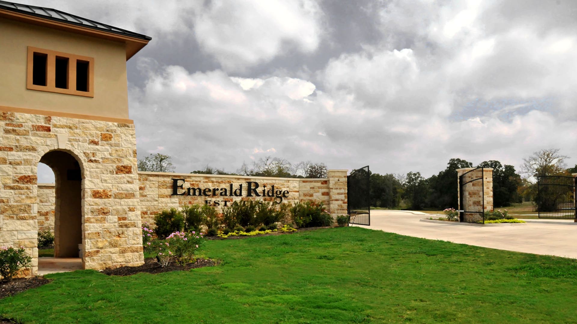 A sign that says emerald ridge in front of a building.