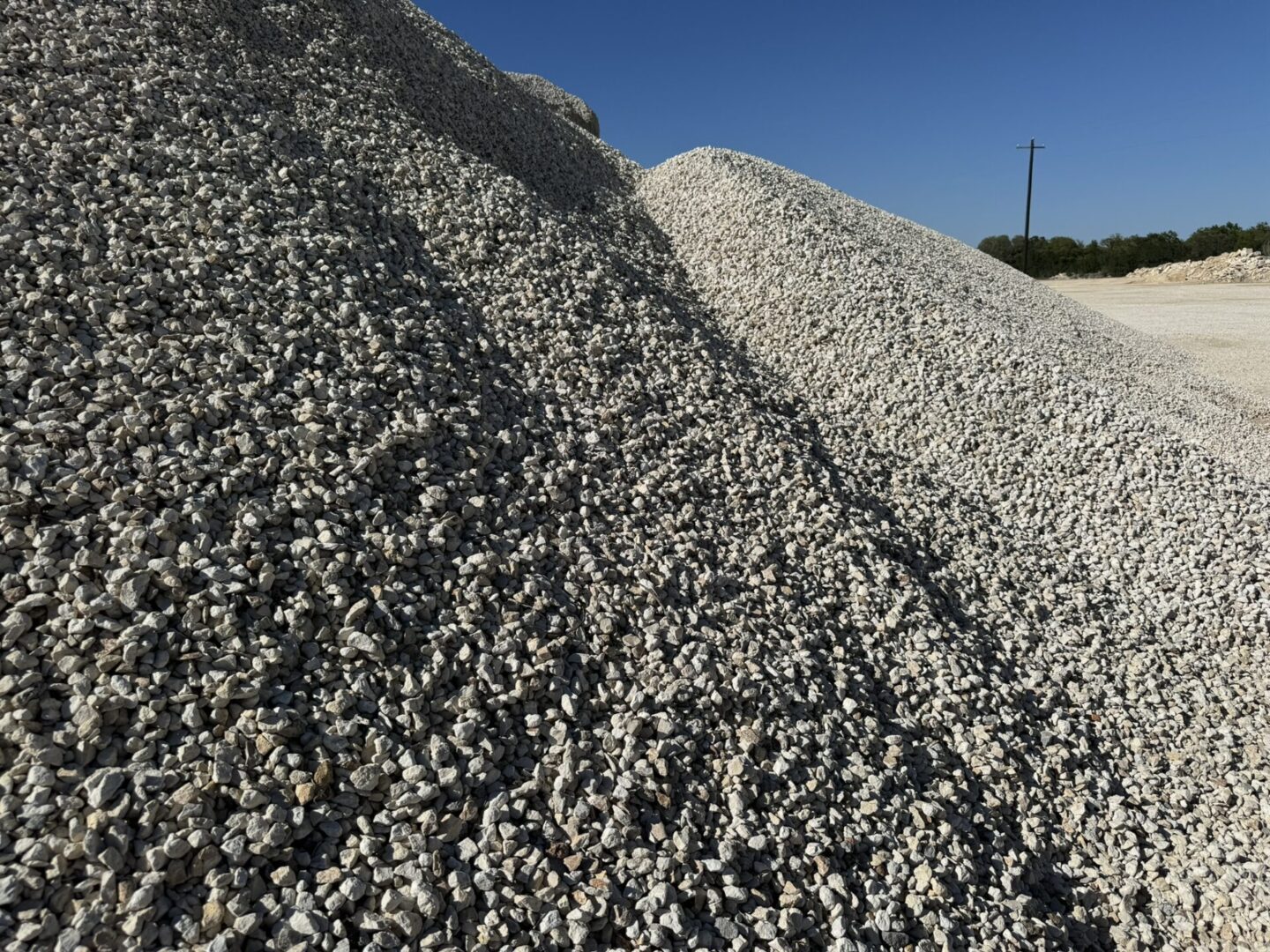 A pile of gravel on top of a hill.