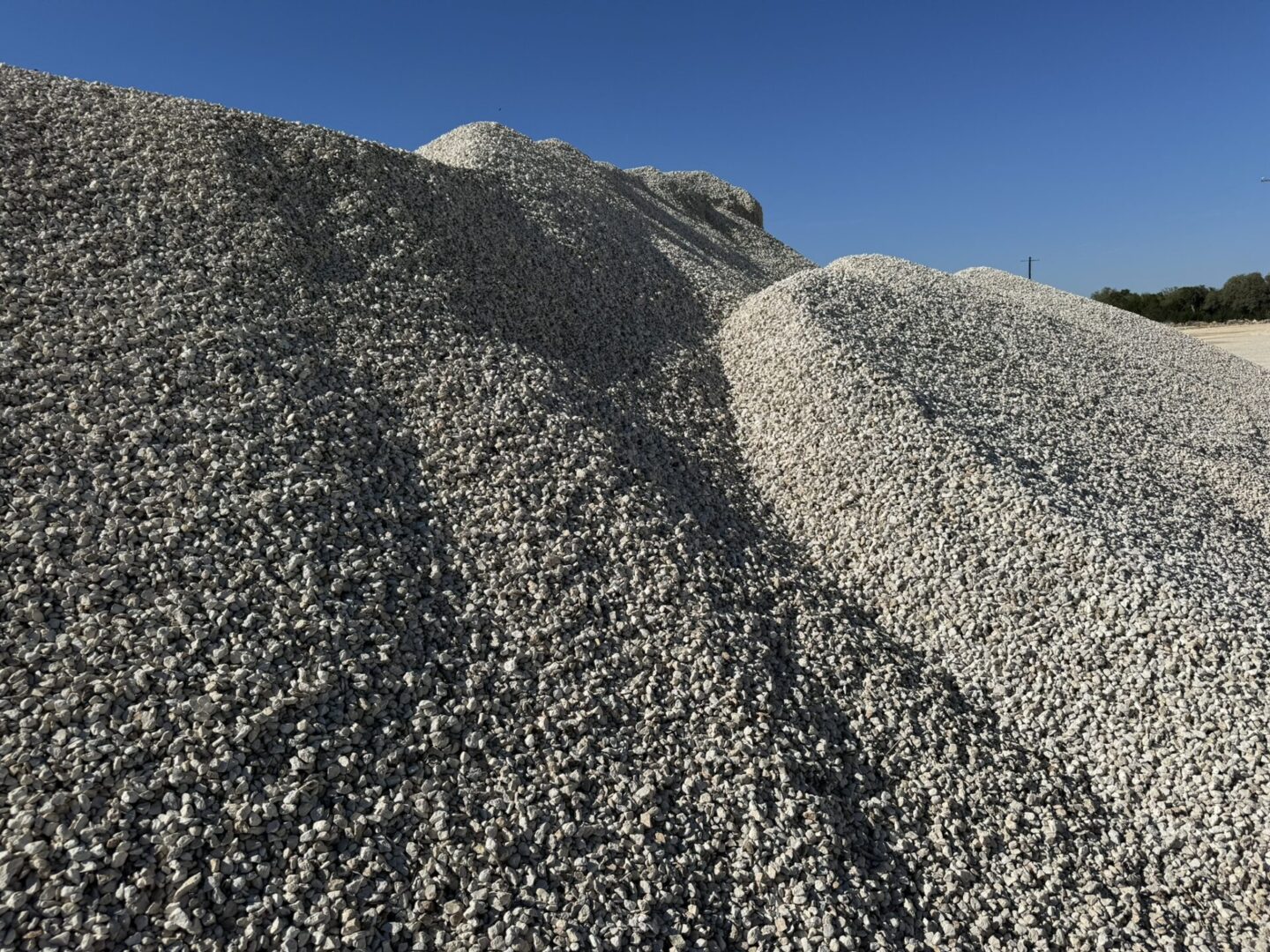 A pile of gravel on top of a hill.