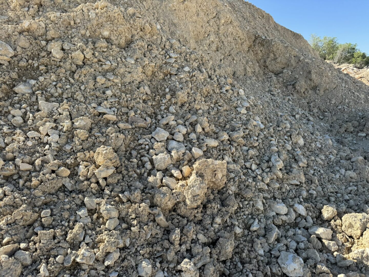 A pile of rocks that are on the ground.